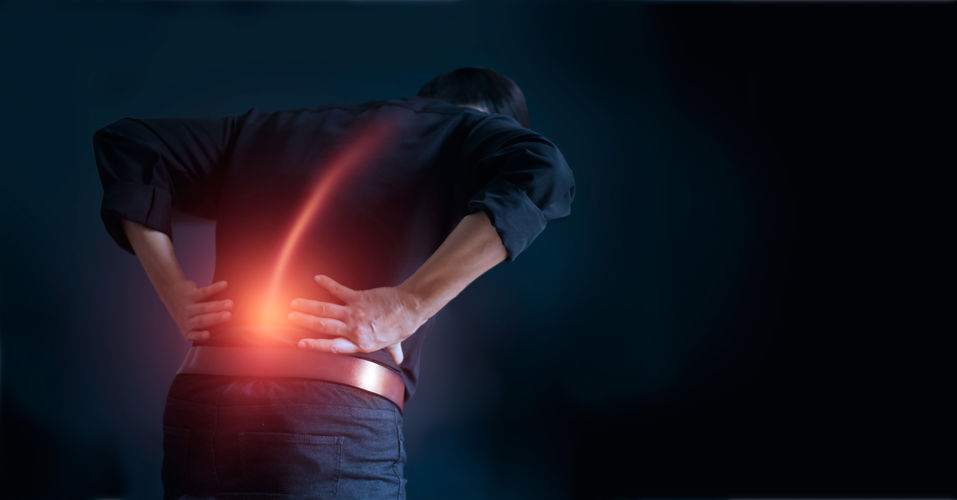 Man suffering from back pain cause of office syndrome