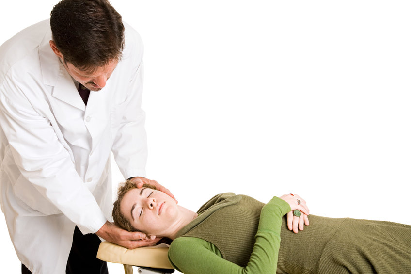 Chiropractor adjusting a patient's neck