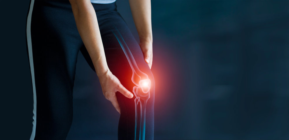 Sport woman suffering from pain in knee.